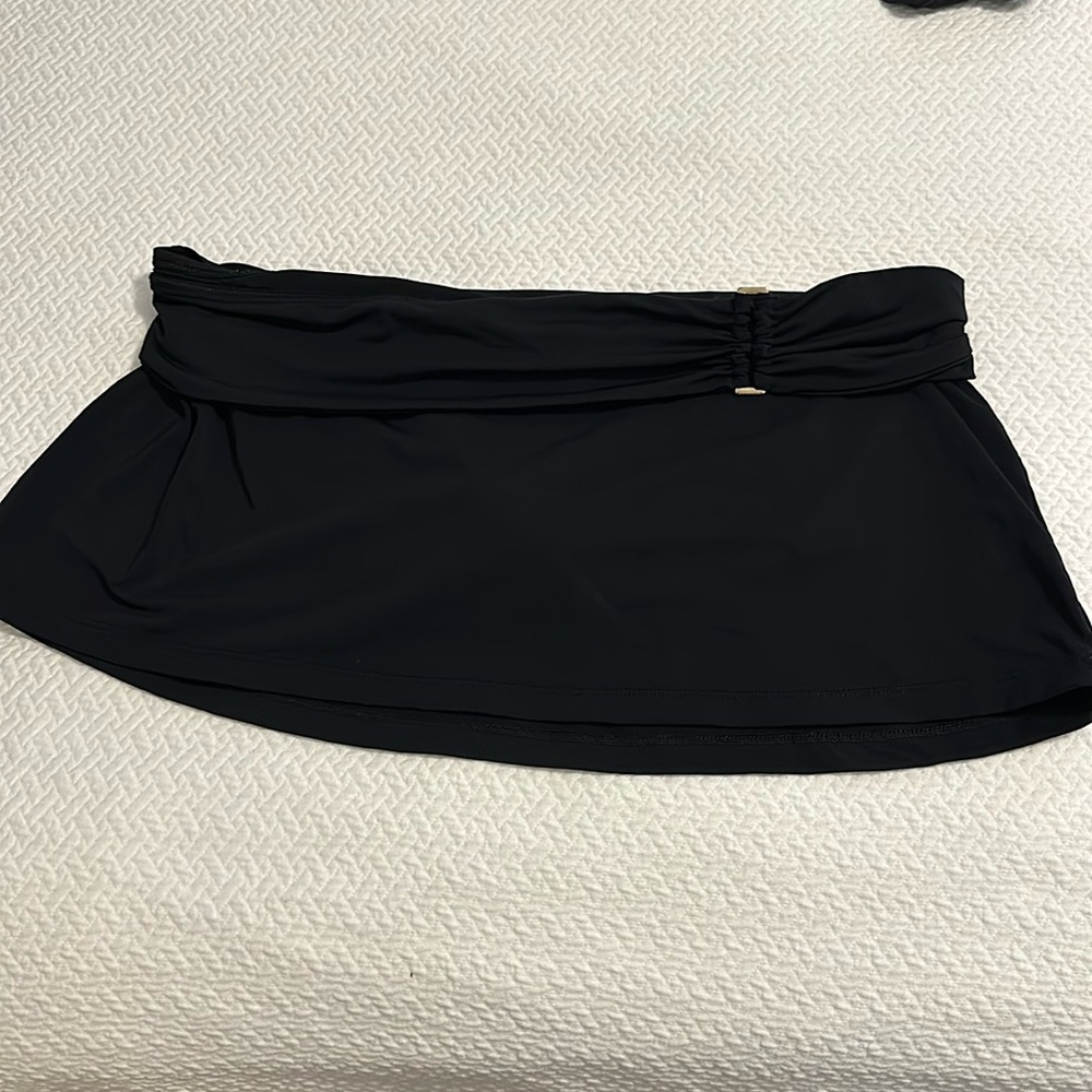 Swim skirt size large. Fold over waist, super flattering. Not bulky when wet
